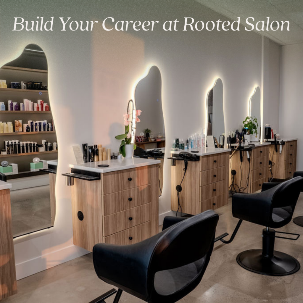 Spacious hair salon styling area with wood cabinetry and illuminated mirrors, perfect for a career in beauty in Allentown, PA.